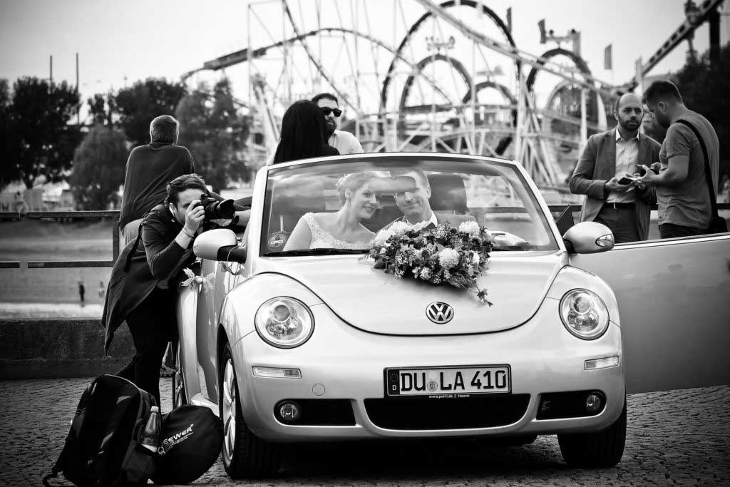 bride and groom in car