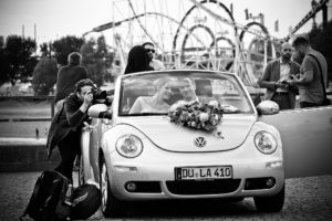 best wedding video shooting tips - videographer getting the best angle