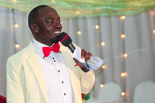 a black man speaking at a wedding