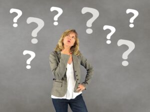 woman with questions mark around her