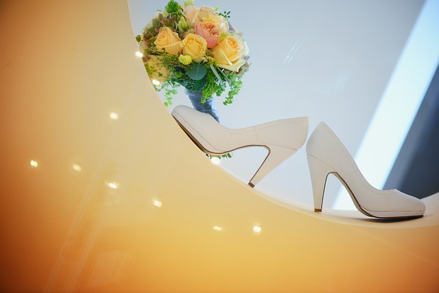white wedding shoes and a bouquet