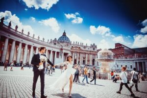 bride and groom standing in middle of rome
