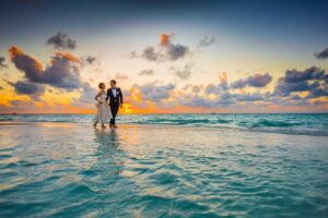 bride and groom walking on water