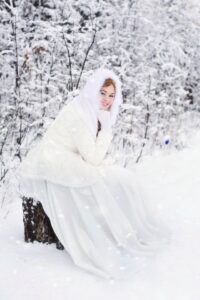 bride sitting on the snow