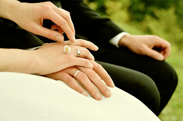 bride and groom holding hands