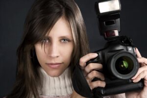 woman with a camera and lights