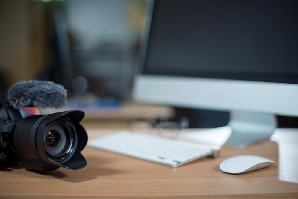 Imac and video camera on table