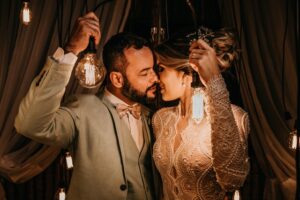 bride and groom holding lights