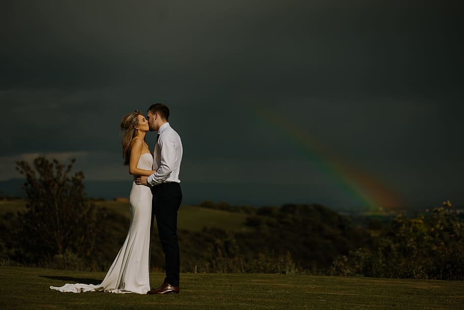 bride and groom with randow in the back