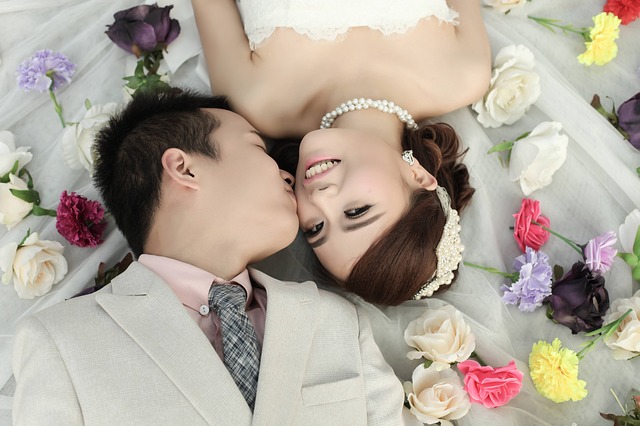 bride and groom laying down
