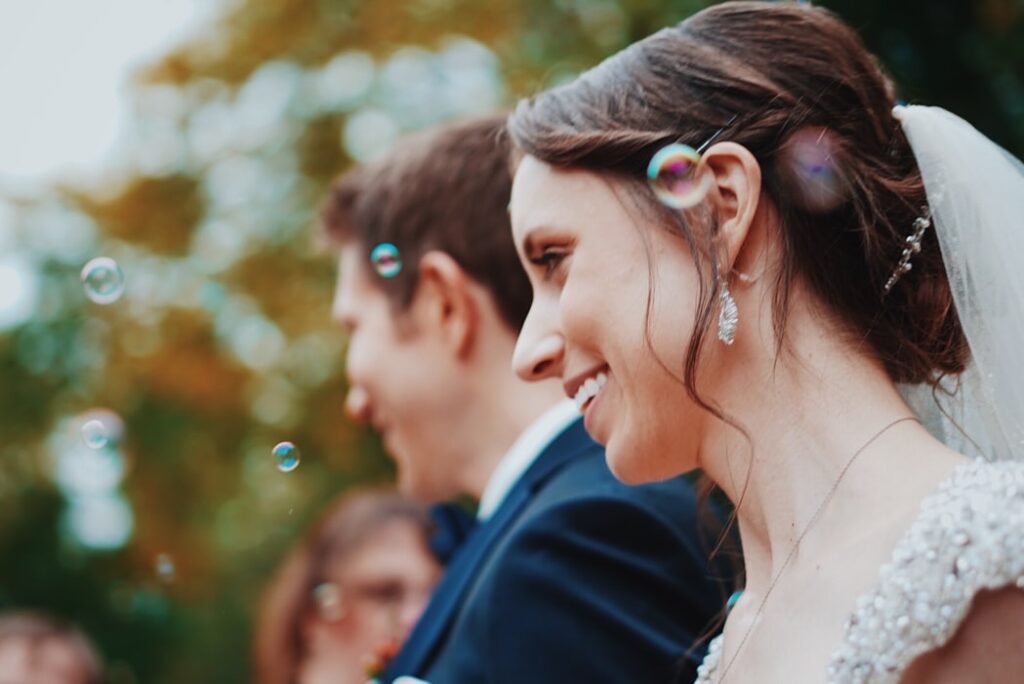 bride and groom with bubbles