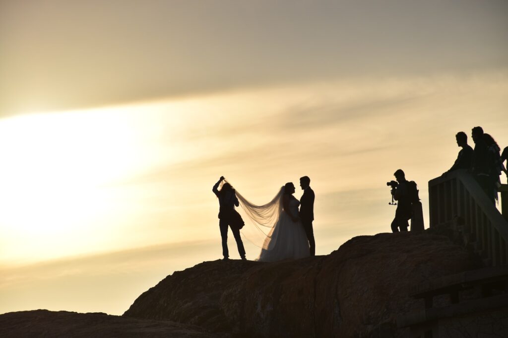 bride and groom on mountain top